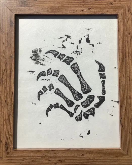 Woodblock print by Daniel Hokusai featuring gothic skeleton and dinosaur claw design